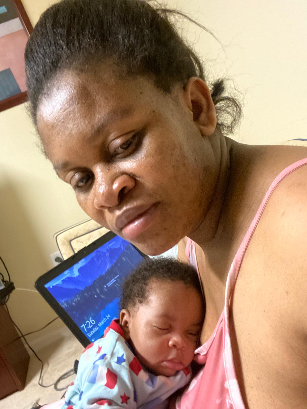 Faith holding her newborn